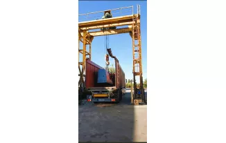 PLACING ON CONTAINER WITH OUR GANTRY